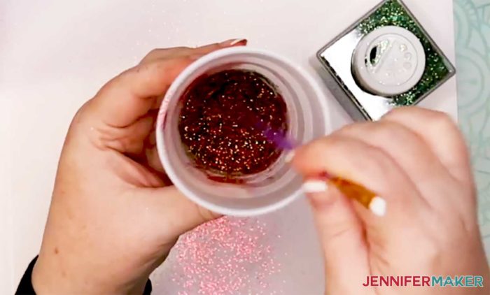 Combining red and green glitter to make a glitter mix for the plaid glitter tumbler