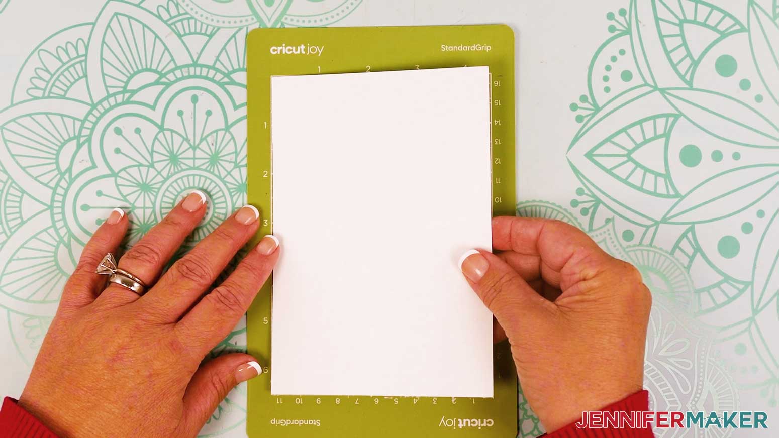 Place the cardstock on the Cricut Joy green machine mat.
