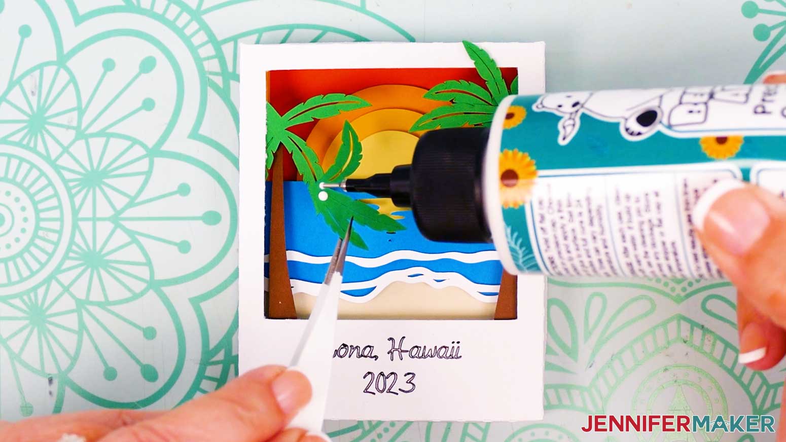 Add a few dots of craft glue to the back center of the palm tree frond for the Polaroid Shadow Box.