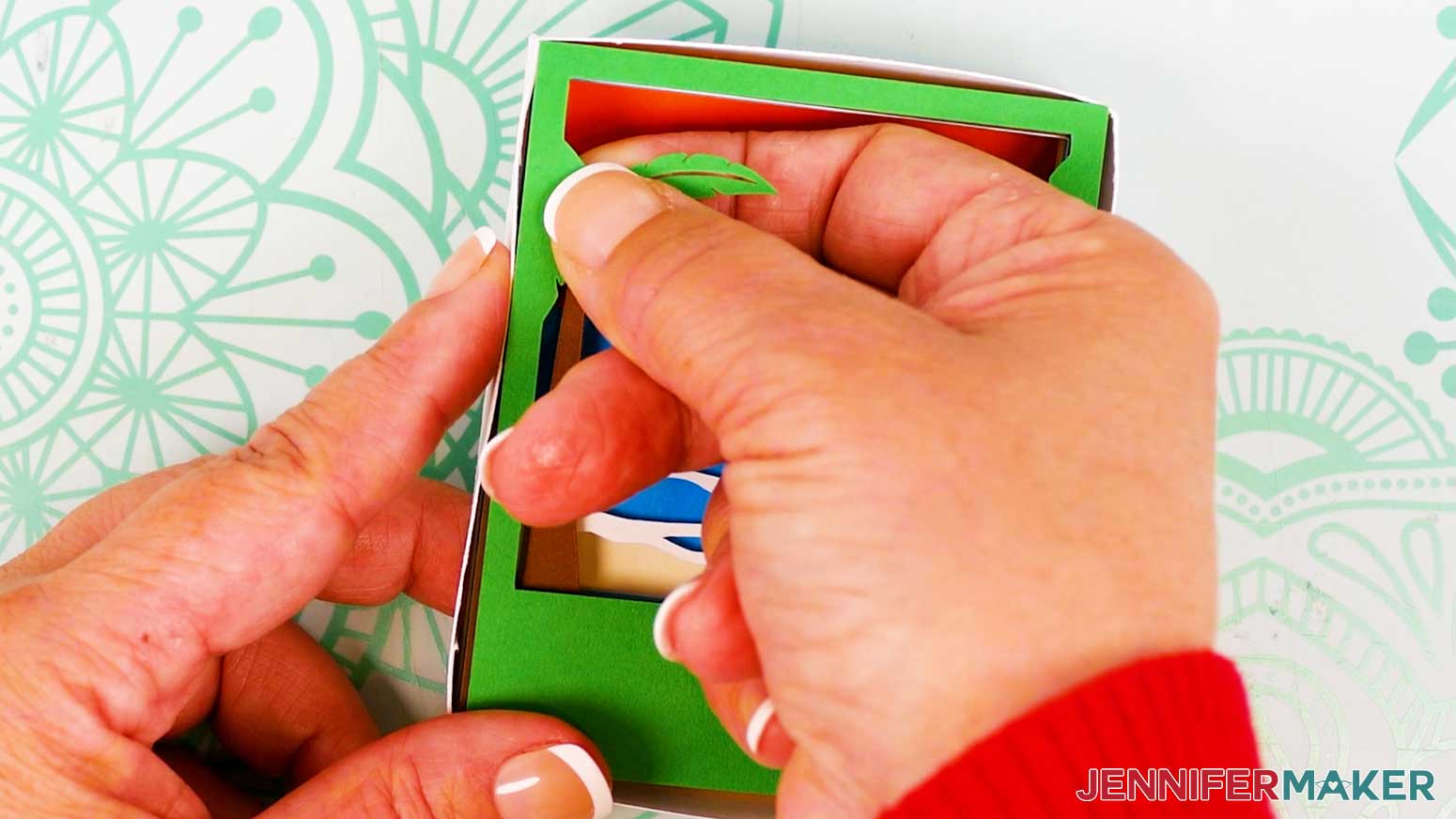 Place the Polaroid Shadow Box green layer for the beach scene into the shadow box.