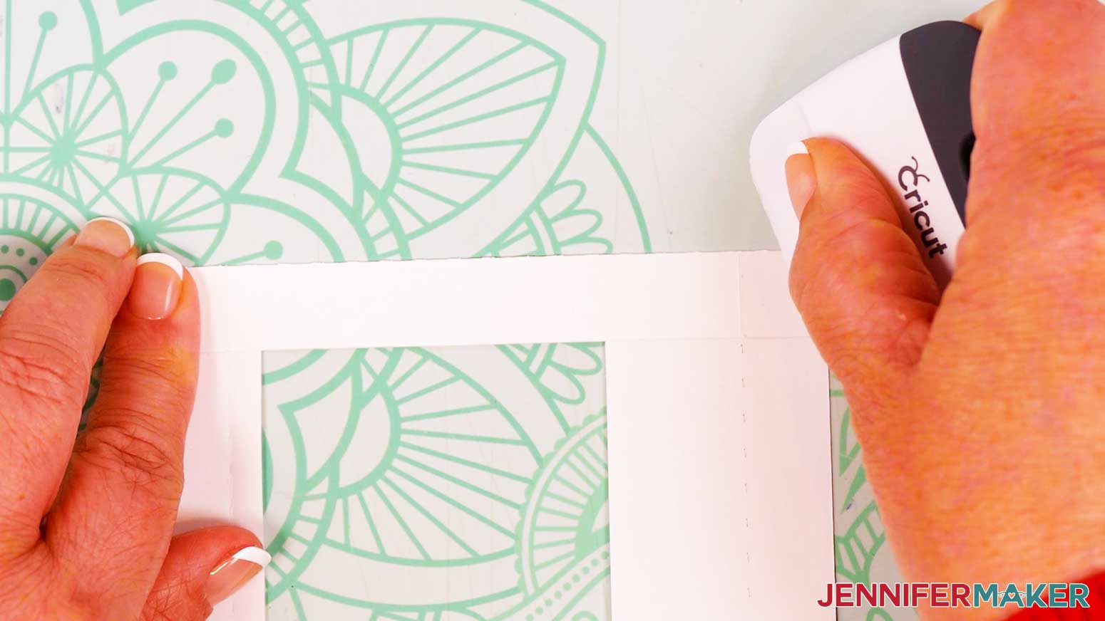 Fold the sides of the Polaroid Shadow Box frame along the creases, using a scraper to sharpen them.