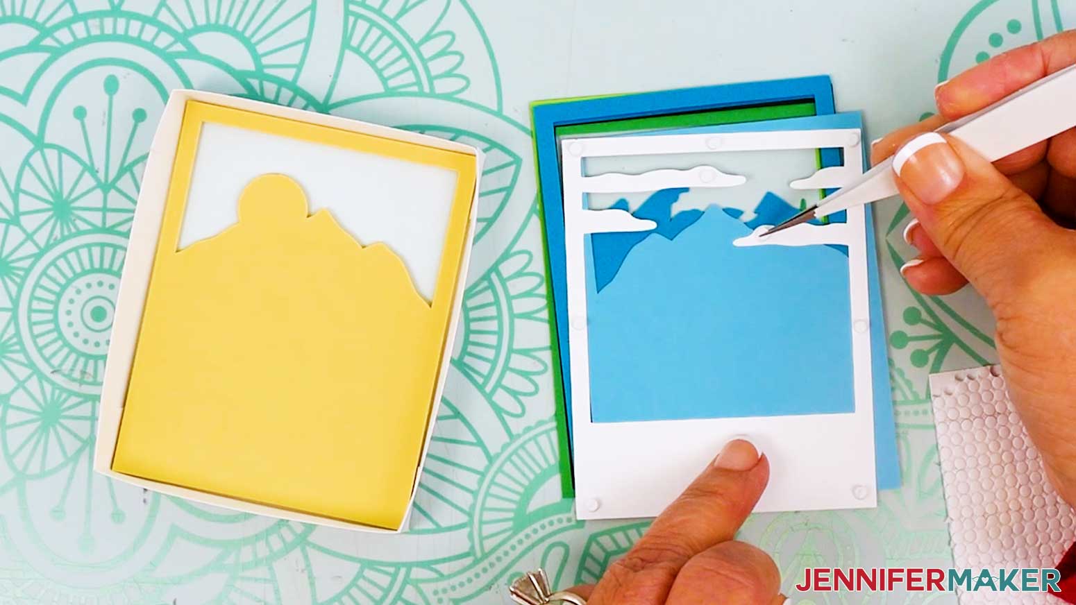 Use tweezers to place micro pop dots on the back of the white clouds layer for the Polaroid Shadow Box mountain scene.