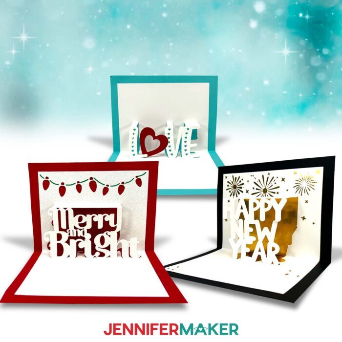 Learn to make a pop up letter card with this tutorial from JenniferMaker! Three pop up letter cards are on display against a teal and white background: a red and white card that says "Merry and Bright," a teal and white card that says "Love," and a black and white card that says "Happy New Year."
