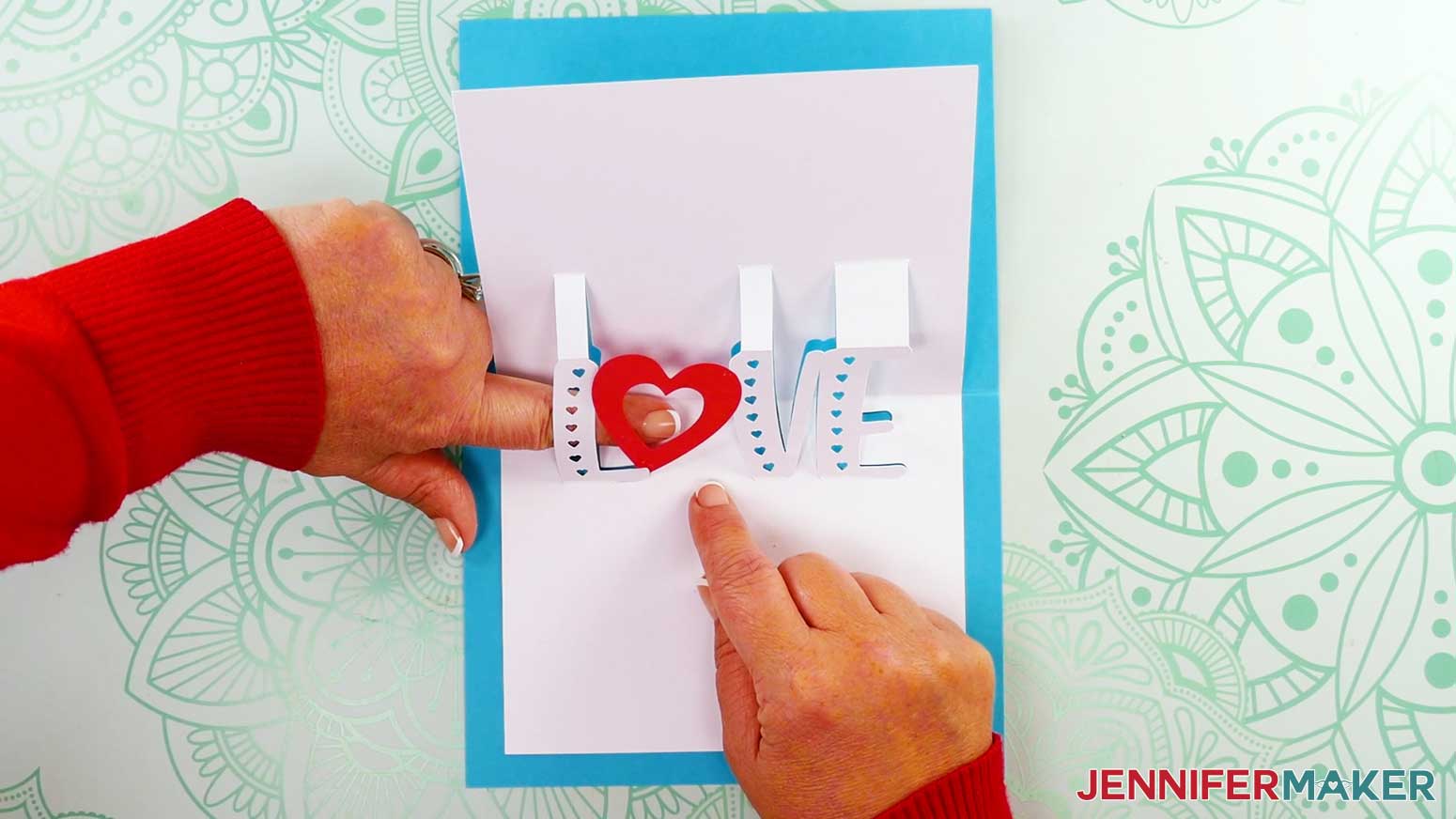 Bottom of inner panel is placed on the card and pressed firmly while glue sets