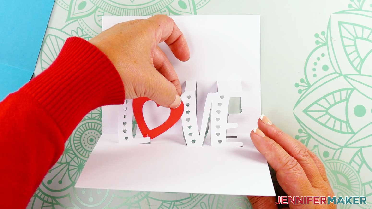 Glue heart shape to L and V on the inside of the card