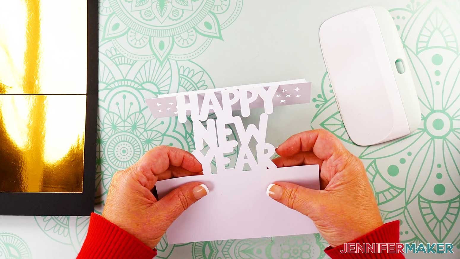 Fold bottom crease of new year pop up card