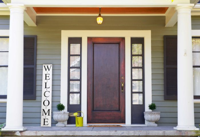 Vertical Wood Welcome Sign on a pretty front porch