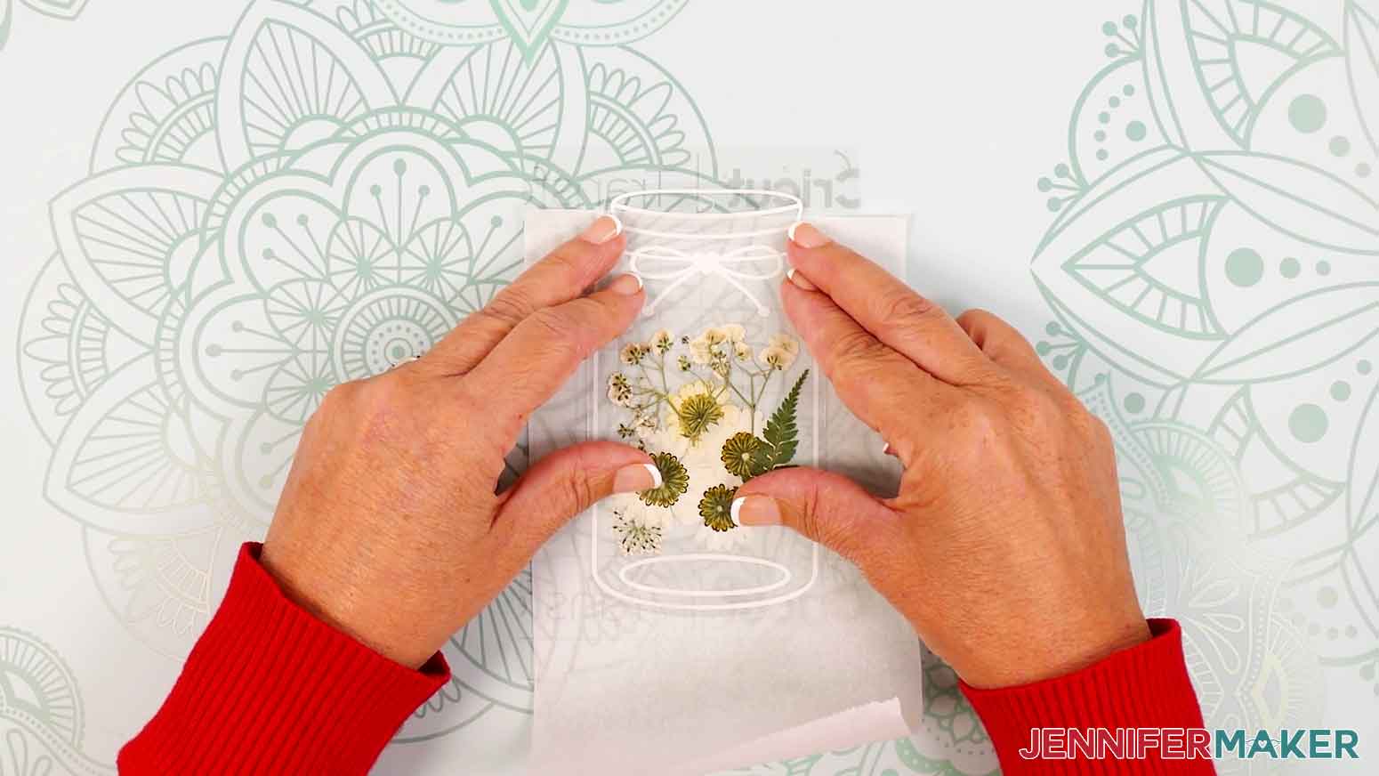 Align the laminated flowers onto the vinyl and transfer tape.