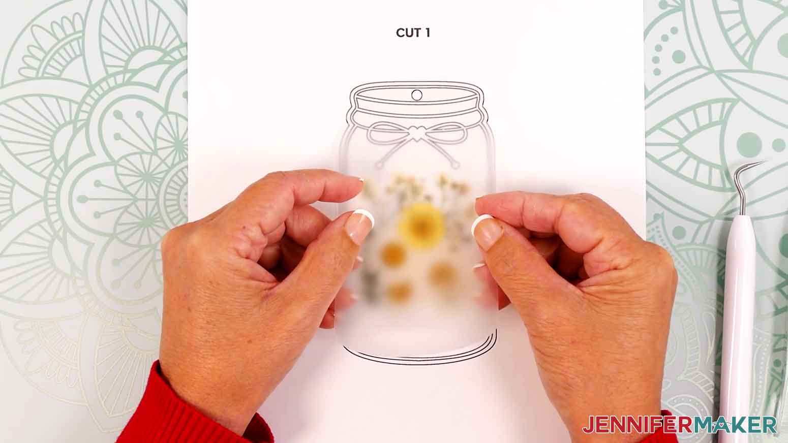 Align the top layer of laminate over the dried flowers and base layer