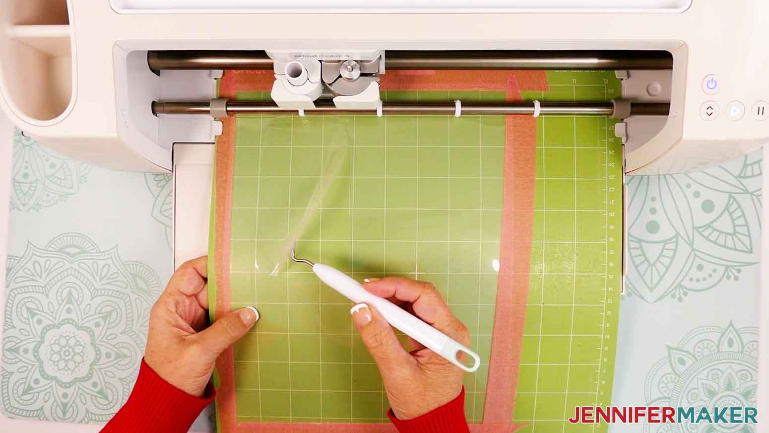 Use a weeding tool to check the that the laminate sheet cut all the way through before unloading the machine mat from the Cricut.