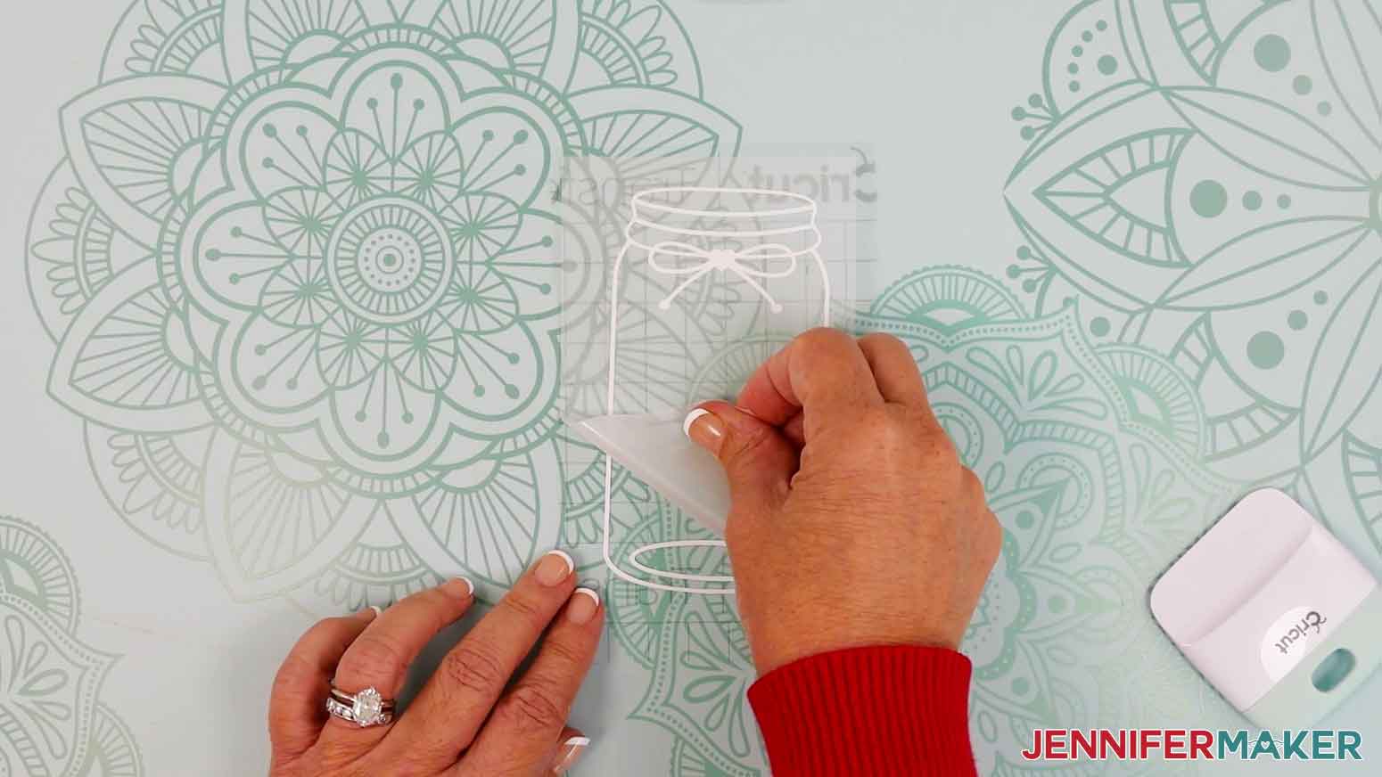 Gently remove the vinyl backing from the vinyl and transfer tape.
