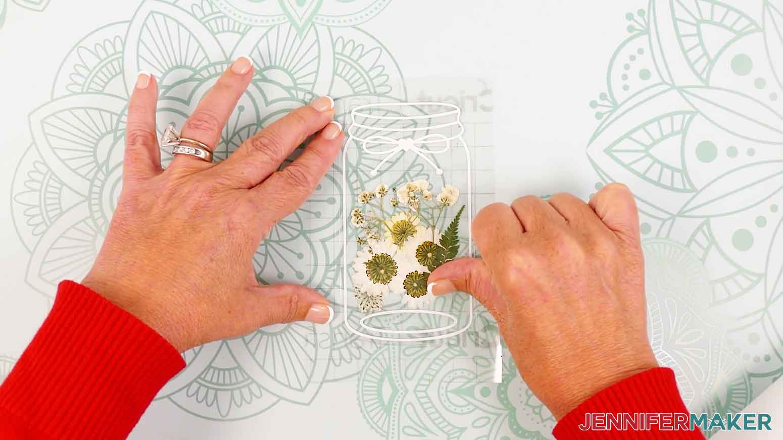 Smooth the laminated bookmark onto the vinyl and transfer tape.