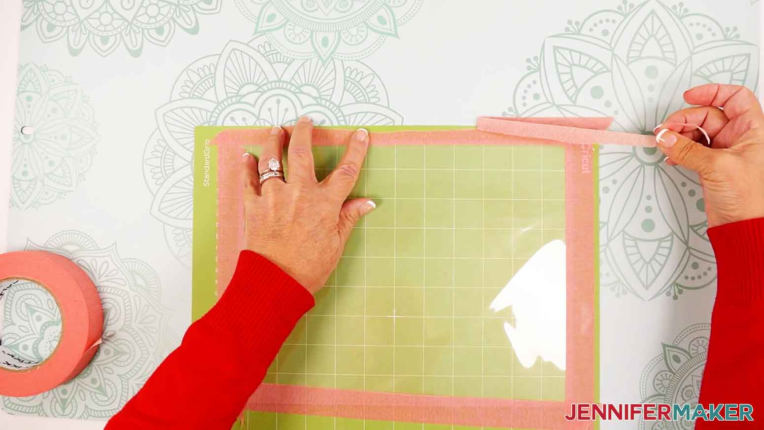 Peel the edges of the painter's tape for any areas overlapping the edge of the machine mat.