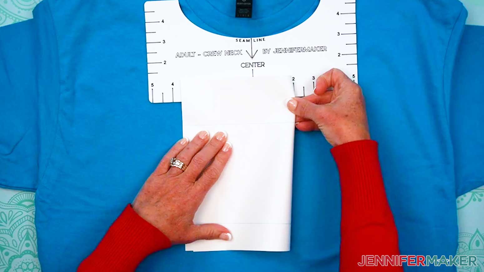 Gently fold the design in half and crease it along the top and bottom.