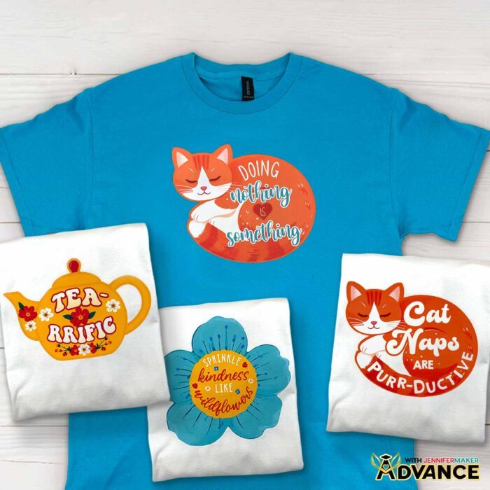Jennifer Maker shows off a collection of turquoise and white Print Then Cut Iron-On T-shirts on display, featuring cute and cozy designs of cats, teapots, and blooms with quotes