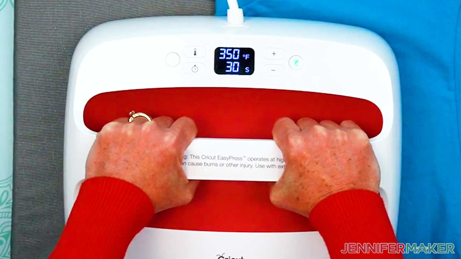 Fold the shirt in half and press along the center to preheat the shirt and create a crease.