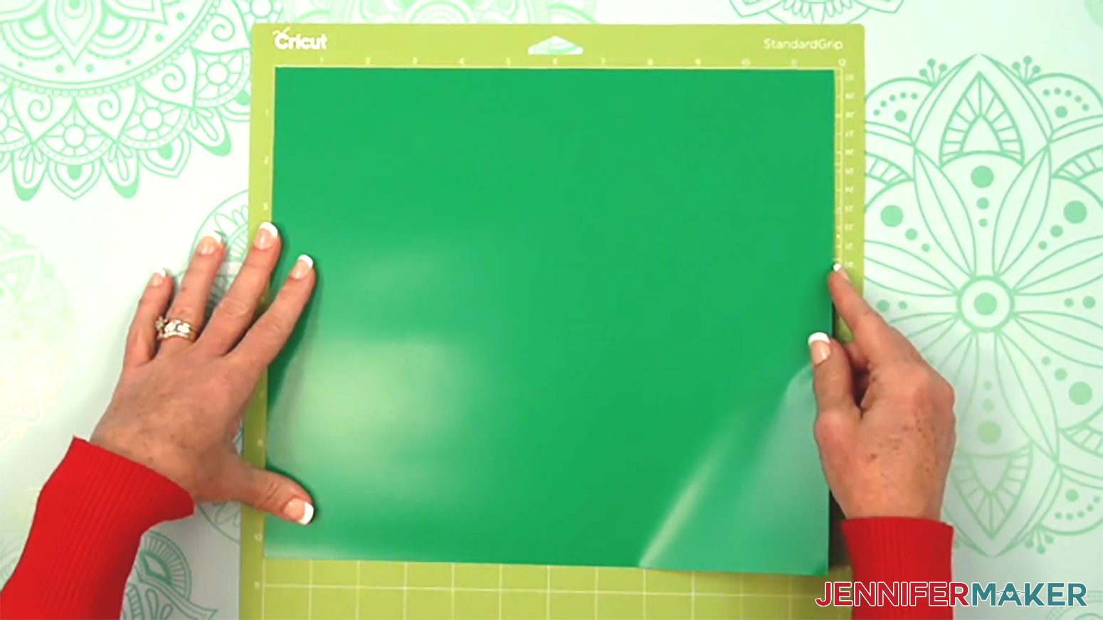Place the glitter vinyl for the first layer of the metallic puff vinyl design onto the machine mat with the side with the carrier sheet touching the mat.