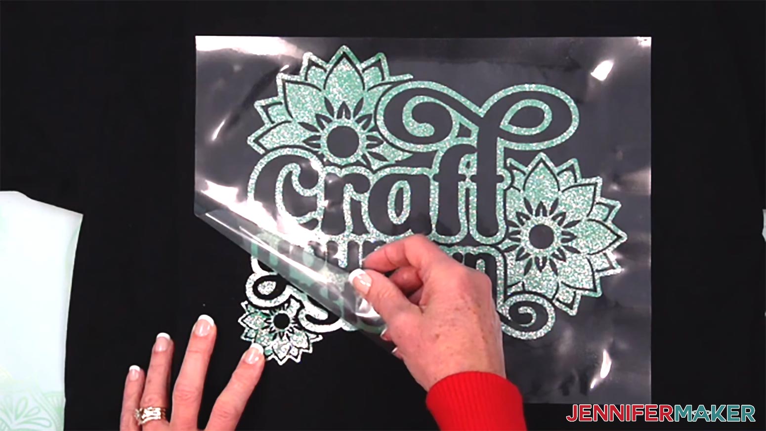 Carefully roll the carrier sheet away from the pressed glitter vinyl layer of the metallic puff vinyl design.