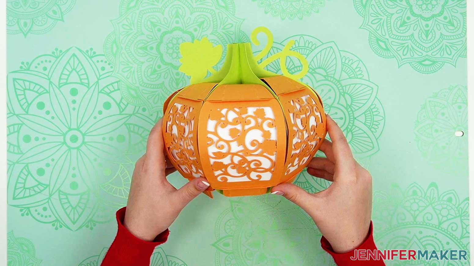 The fully assembled 3D pumpkin lantern with a leaf pattern on the panels