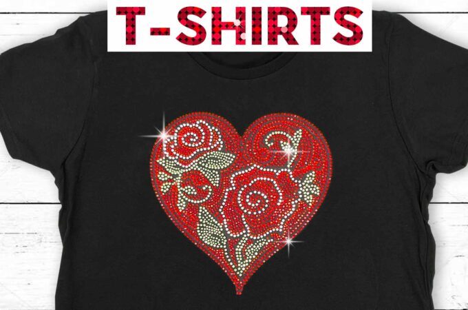 Black t-shirt with a dazzling rhinestone heart and flowers design done in red, green, and clear rhinestones.