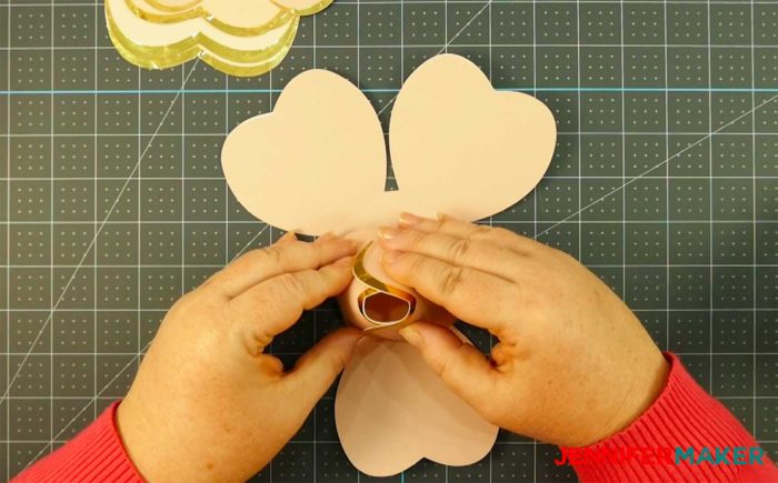 Gluing petals to make a rose gold paper flower