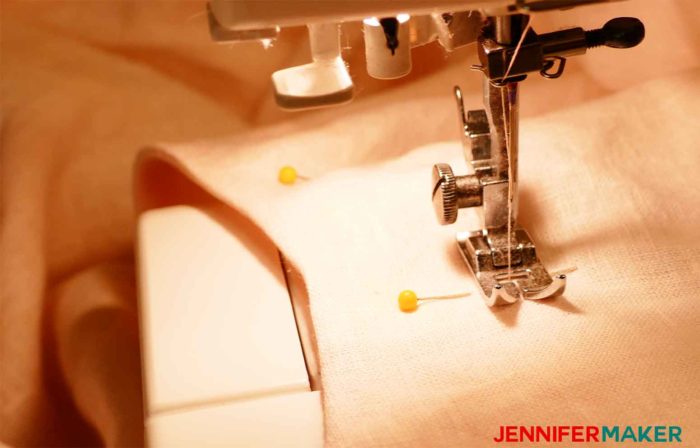 Sewing down the facing on the tunic to sew a round jewel neckline on a shirt or tunic