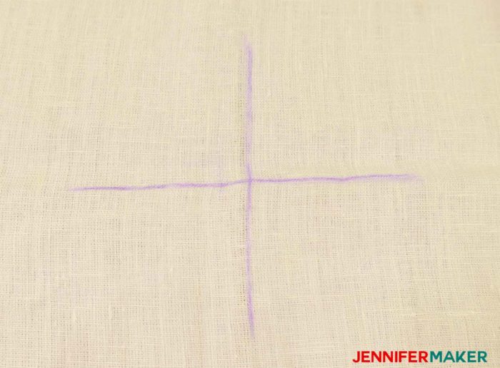 Mark a big cross on your garment to sew a round jewel neckline on a shirt or tunic