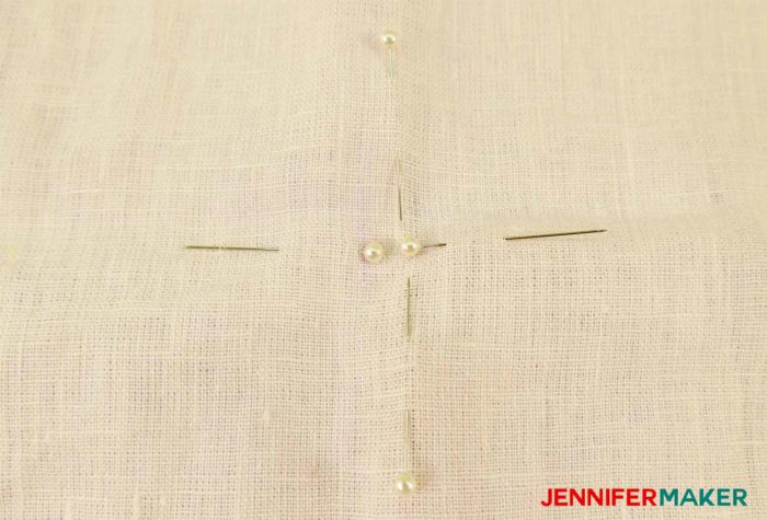 Open and flatten your garment to find the center to sew a round jewel neckline on a shirt or tunic