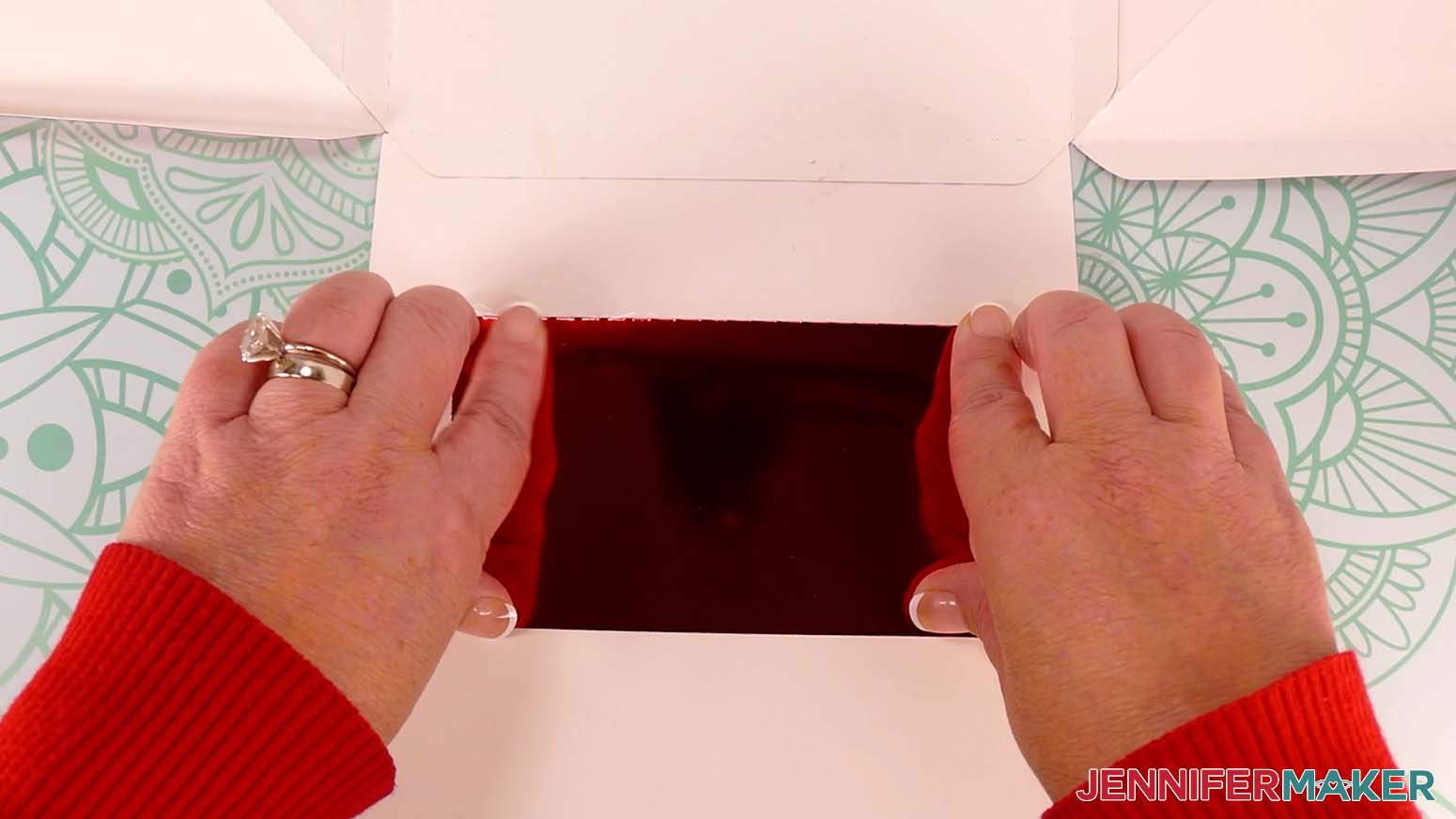 Press along the edges of the tabs to adhere the pocket to the inside of the Santa purse.
