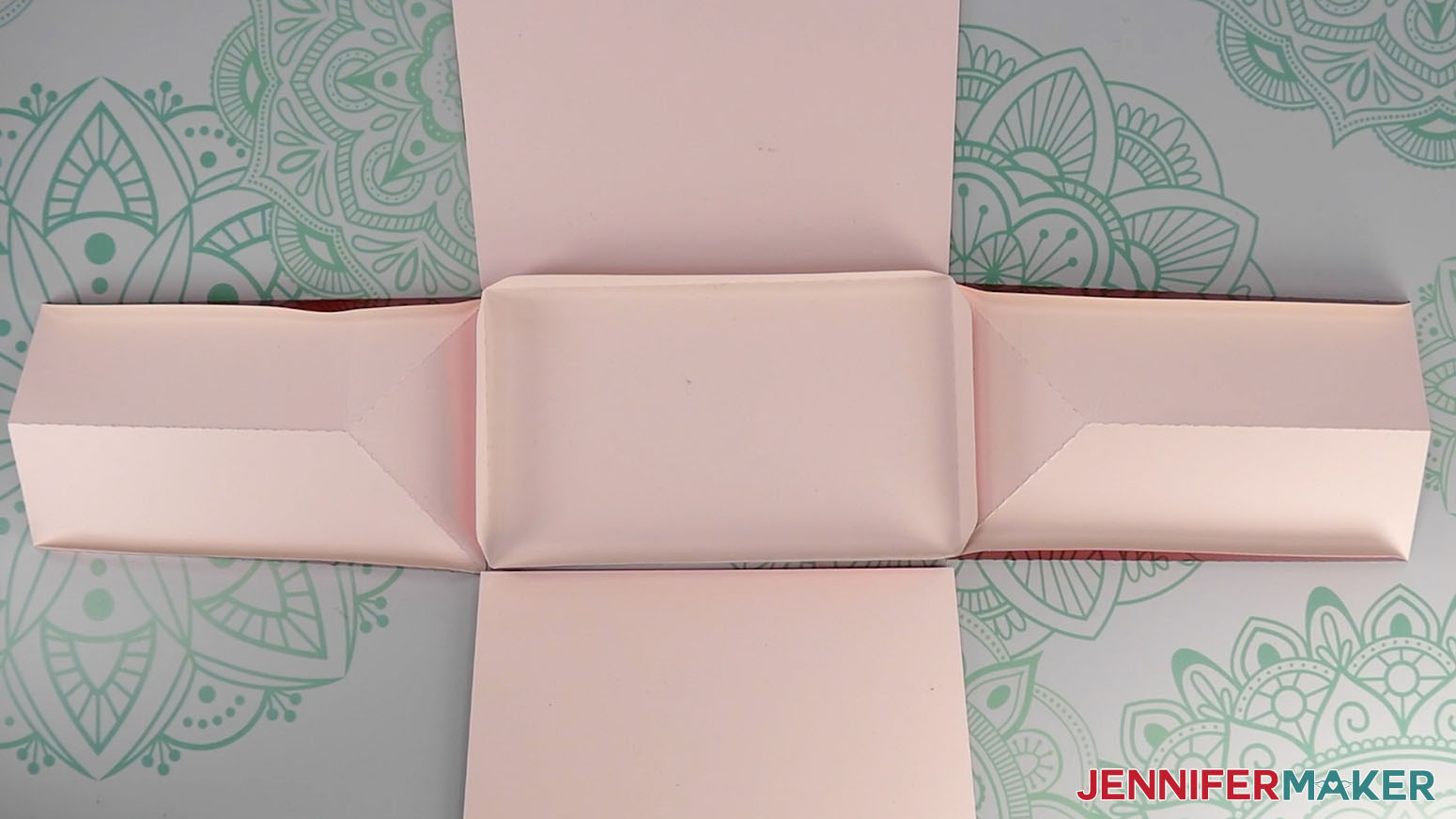Place the Santa purse&rsquo;s two side pieces along the short sides of the base, the front piece along the bottom side of the base, and the back piece along the top side of the base, pretty side down.