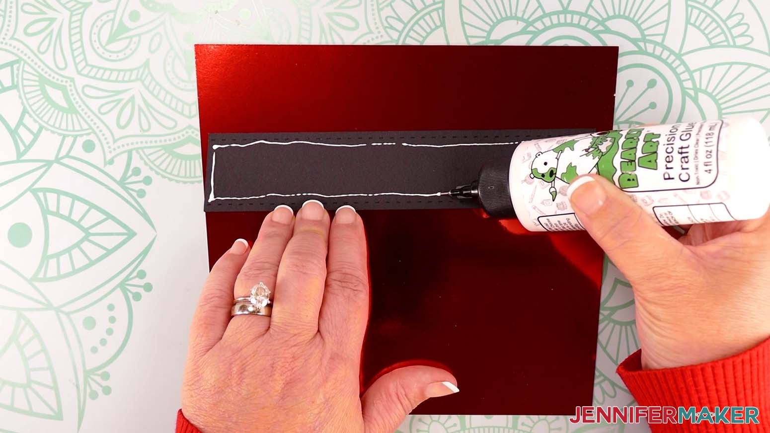 Apply a line of craft glue around the inside edge of the Santa purse belt strap.
