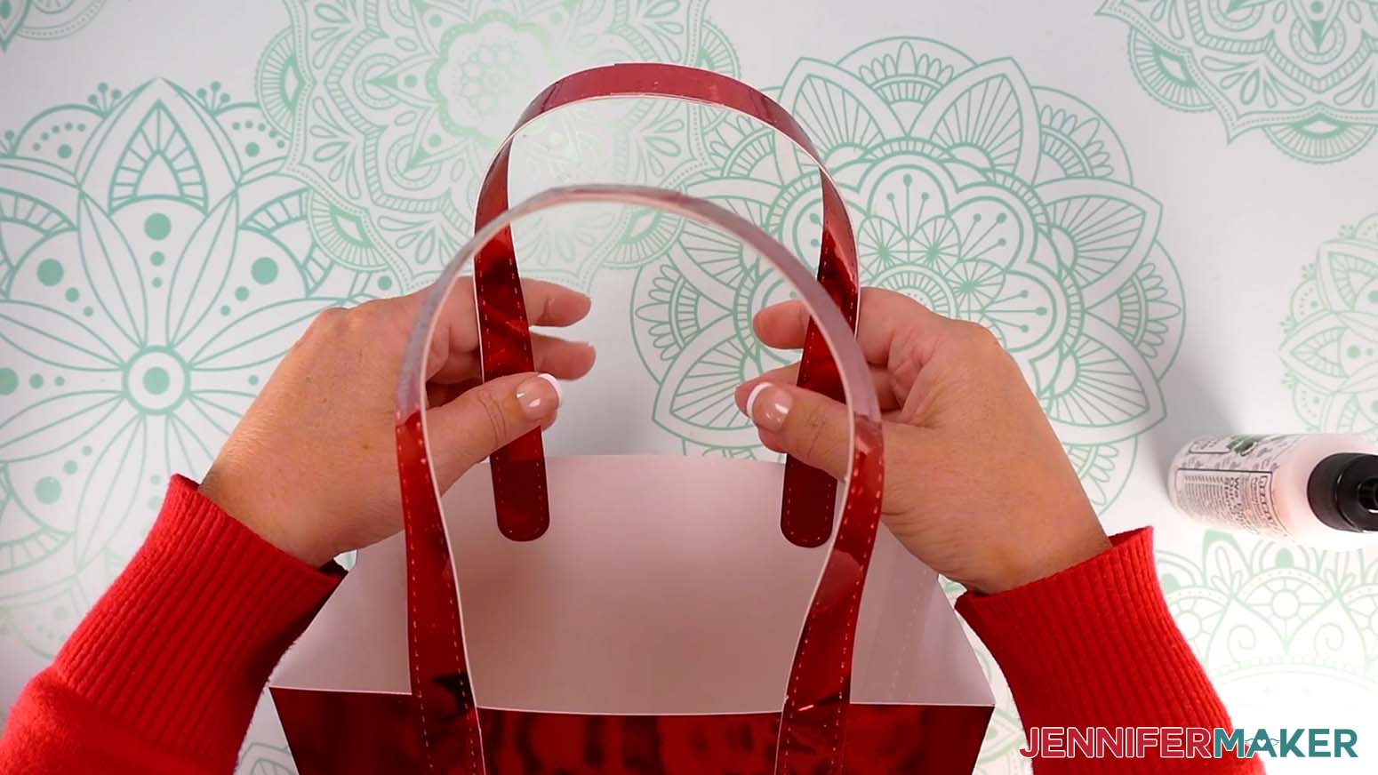 Attach the second handle to the back of the Santa purse gift bag.