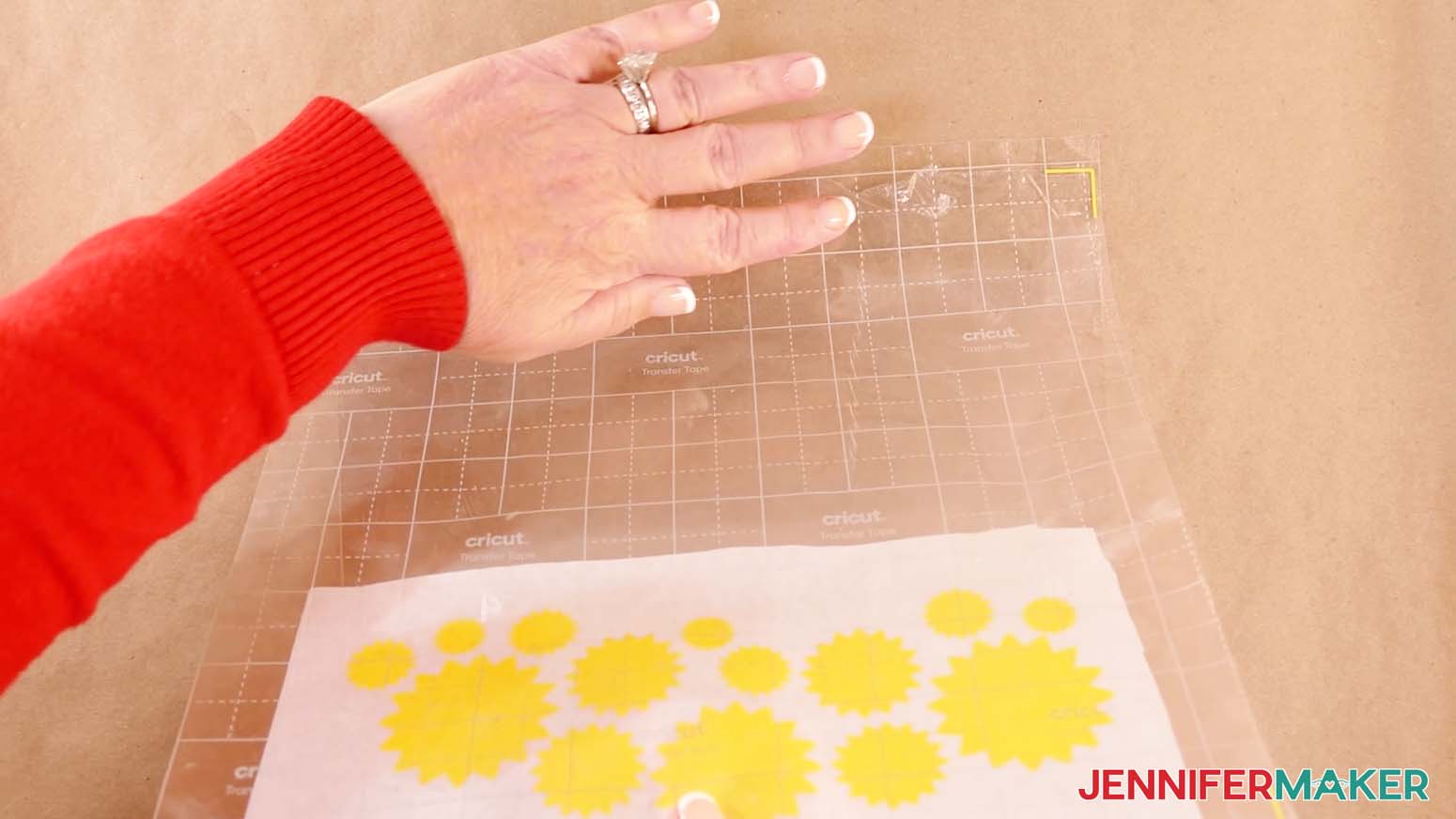 Align the vinyl registration marks to the corners of the acetate to make a shadow box with floating pieces