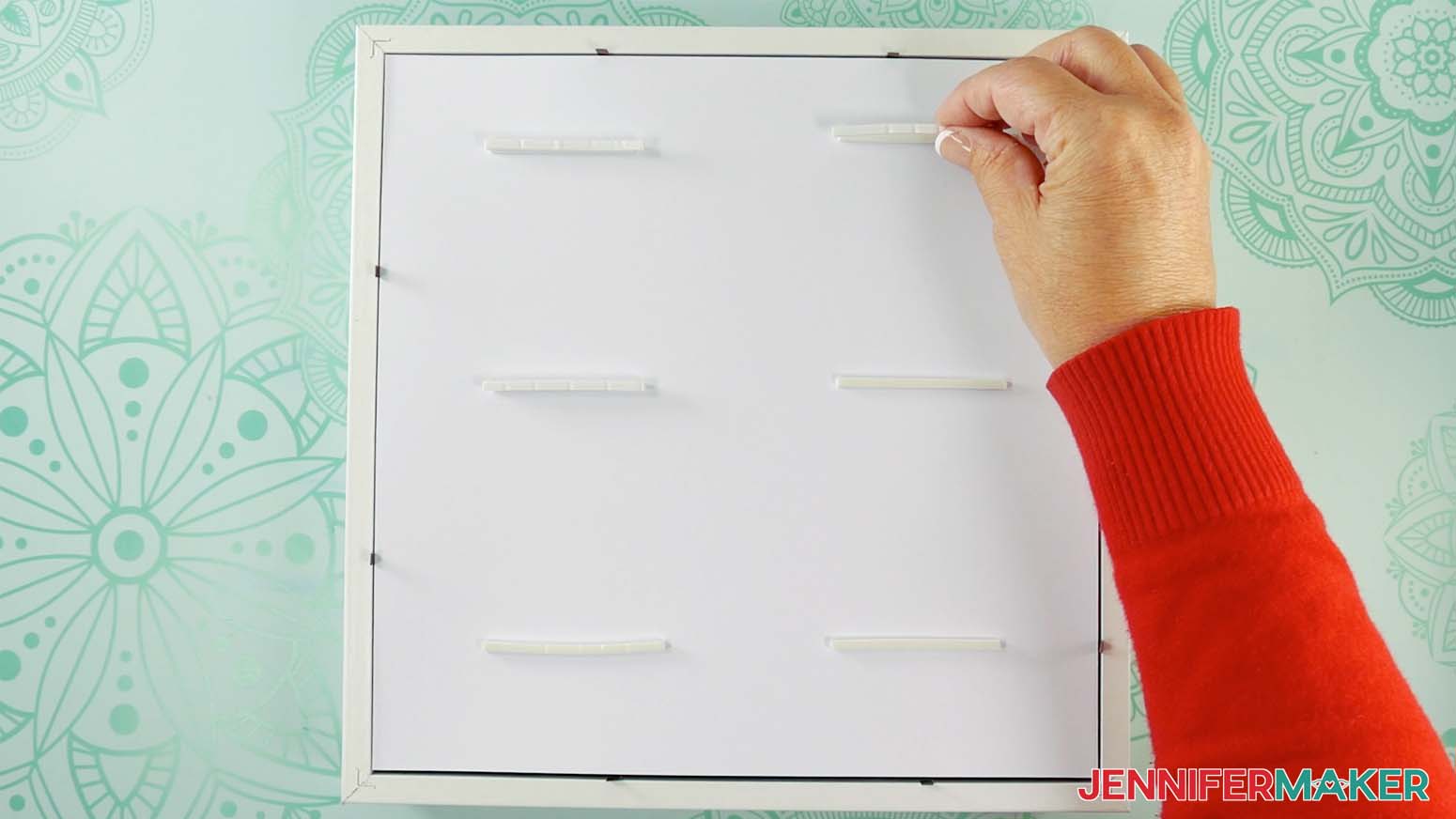 Add two layers of foam tape to the back of layer fifteen to make a shadow box with floating pieces
