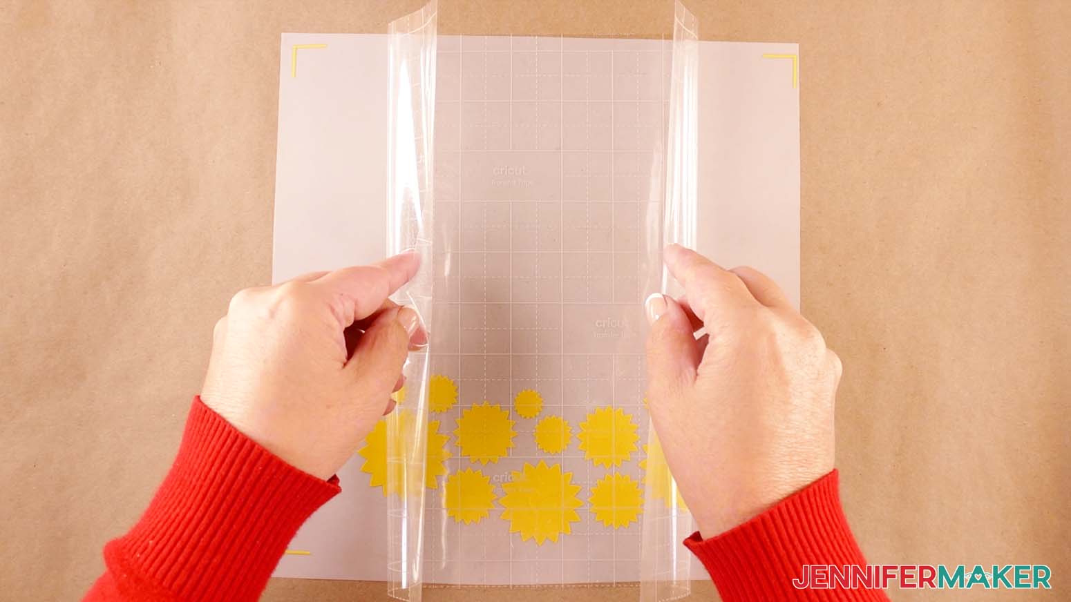 Apply transfer tape to the vinyl design using the taco method to make a shadow box with floating pieces