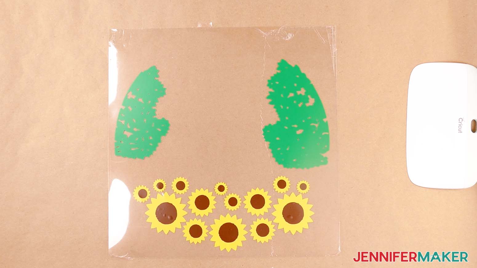 Three layers of vinyl applied to an acetate sheet to make a summer shadow box with floating sunflowers and tree leaves