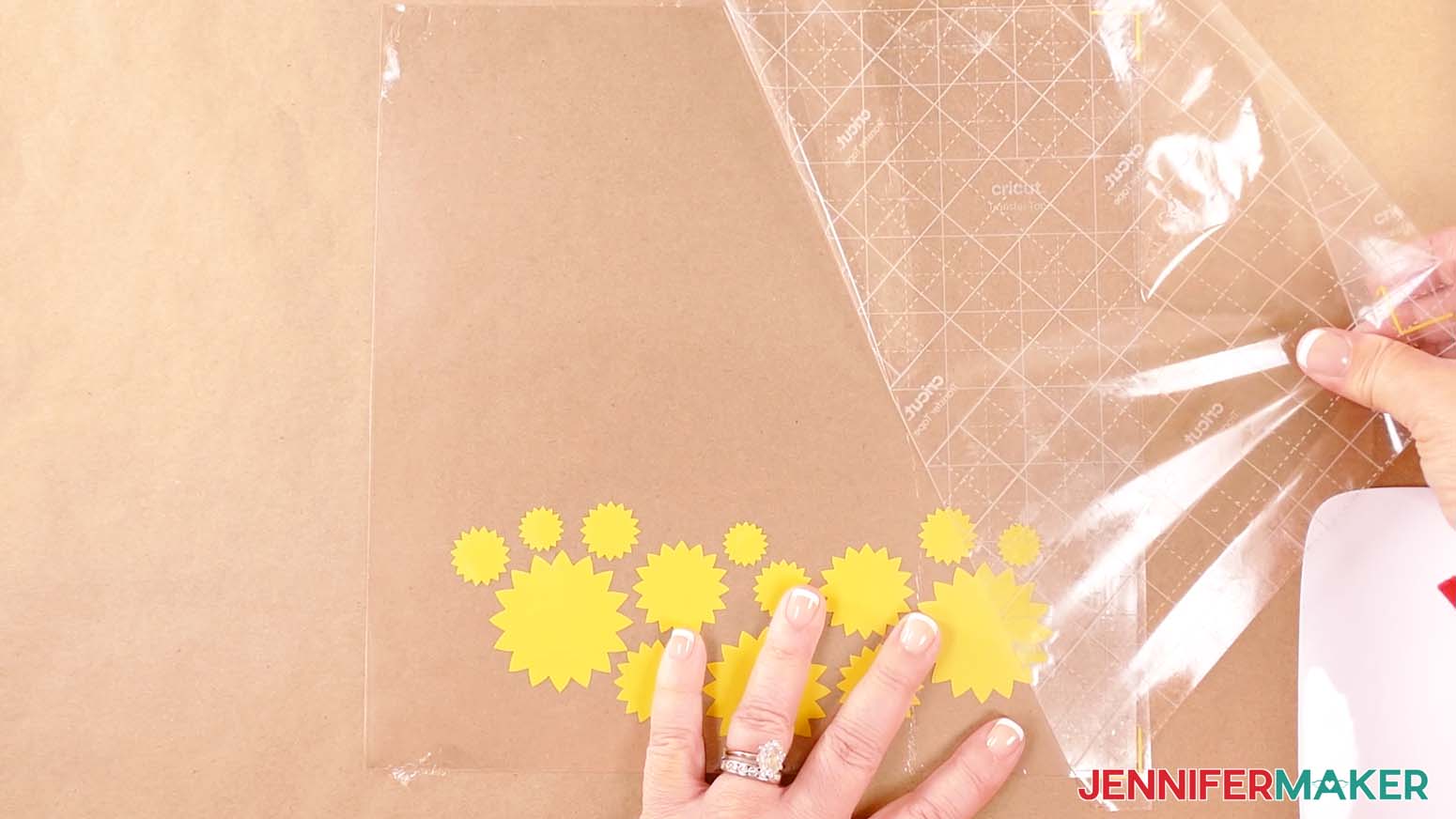 Apply the first layer of vinyl to the acetate sheet and remove the transfer tape to make a shadow box with floating pieces