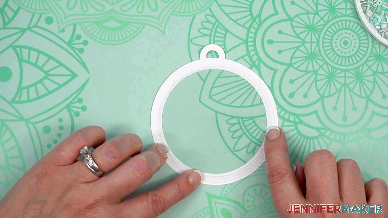 Attach acetate layer to cardstock with glue