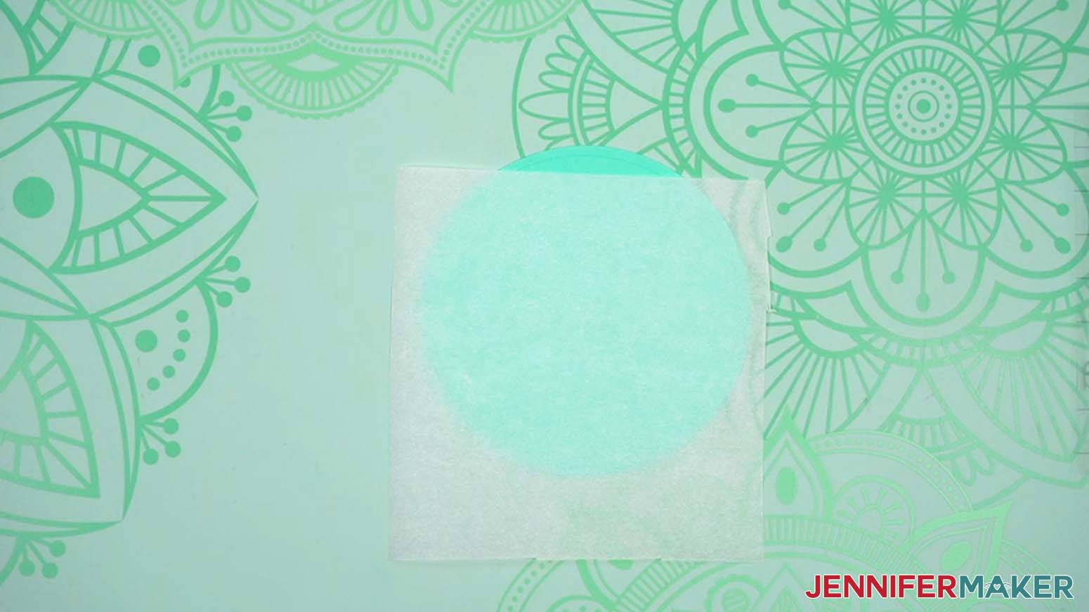 Parchment paper is on top of bottom cardstock layer
