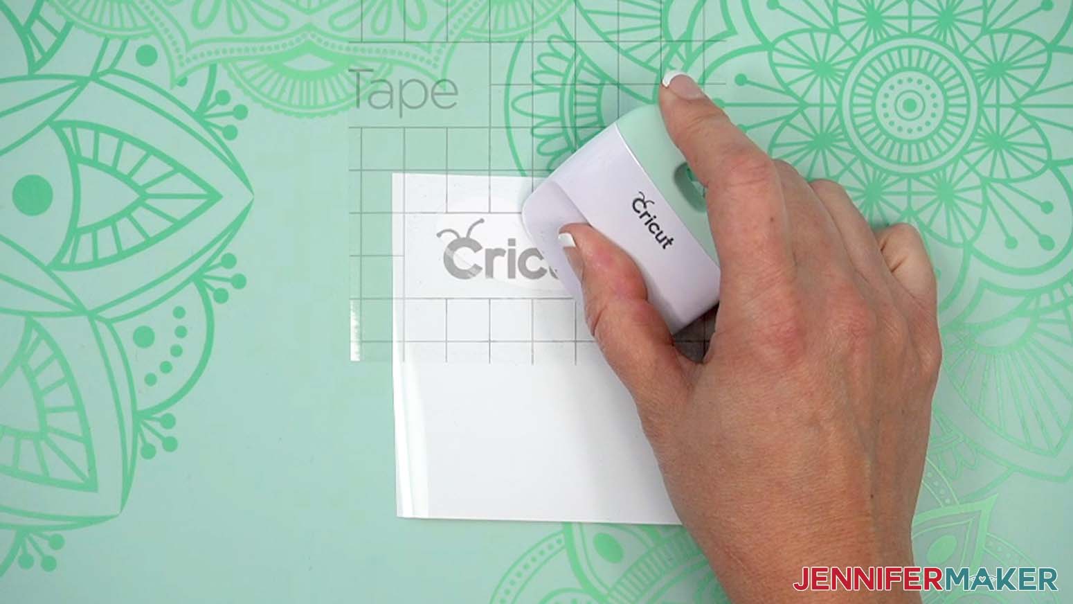 Scraper tool burnishes vinyl to transfer tape