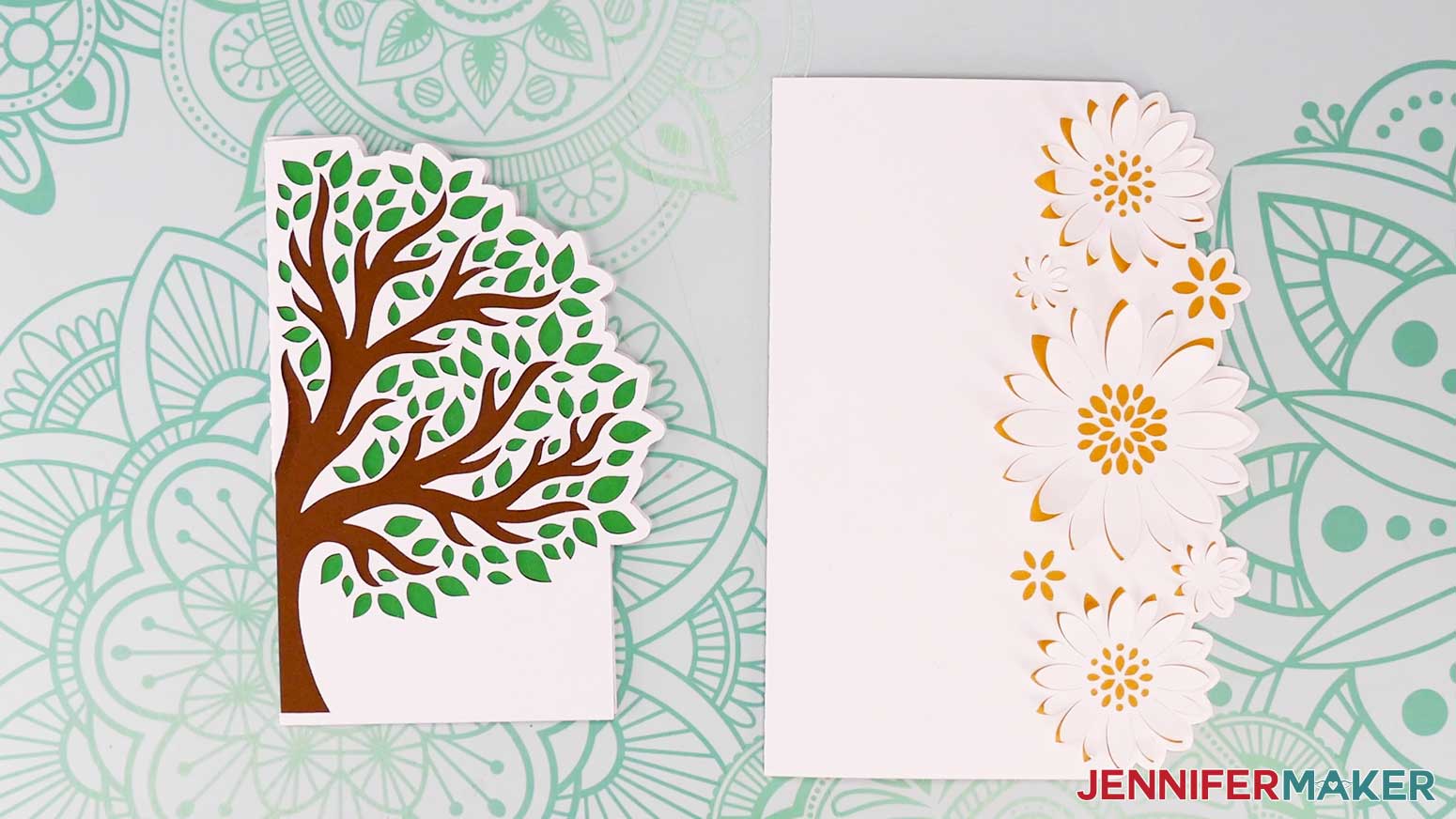 The finished Joy-size tree and 5 inch by 7 inch flower shaped edge cards assembled and folded on a work surface