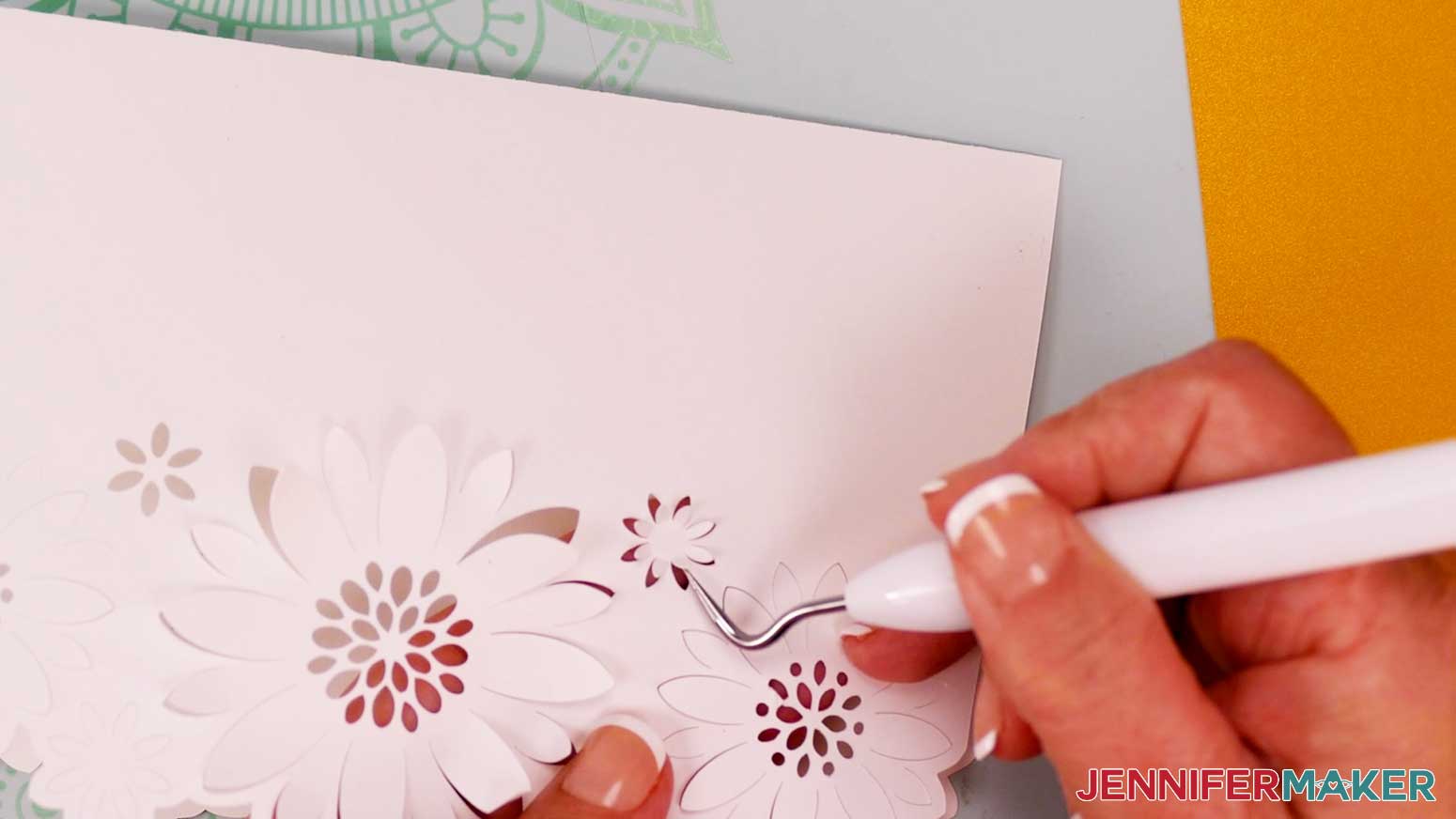 Use a weeding tool to lift and bend the small flower petals upward for the flower shaped edge card design