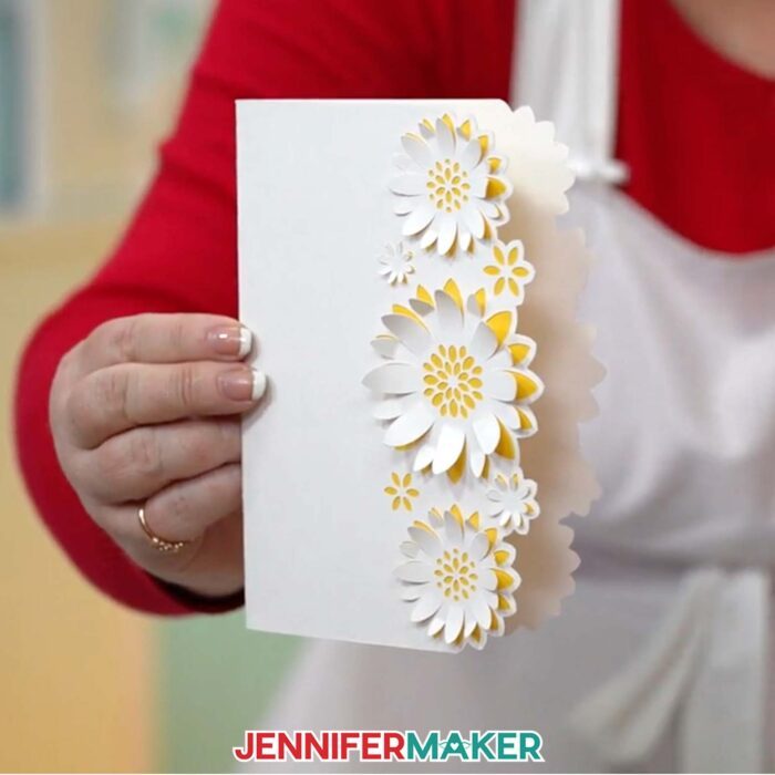 Get free shaped edge cards designs in Jennifer Maker's tutorial! Four shaped edge cards sit on a wooden surface.