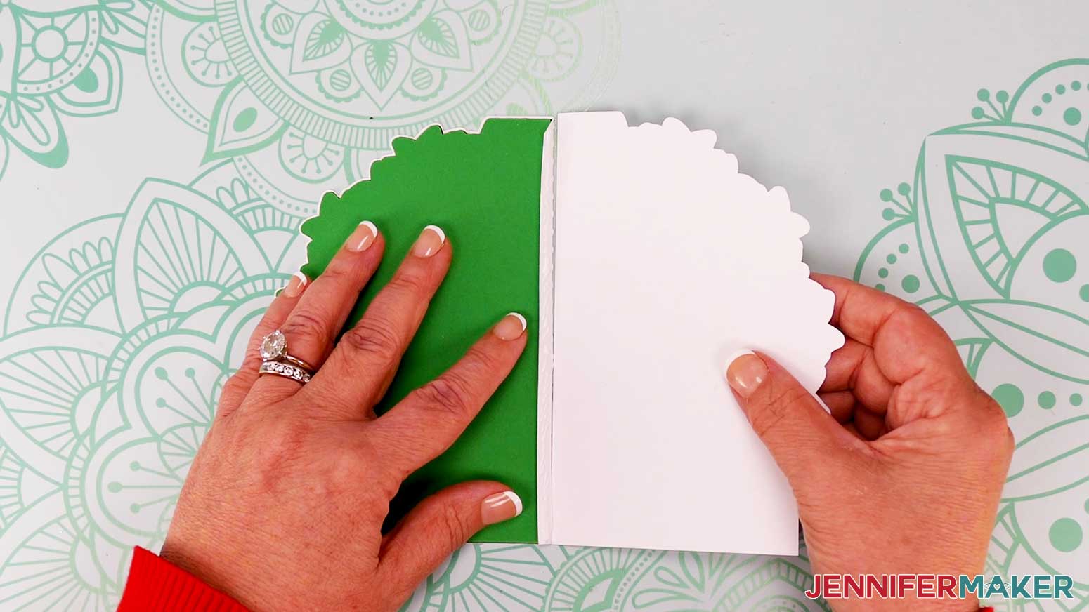Align the inner edges of the front and back panels in order to attach the tab for the Joy-size tree shaped edge card
