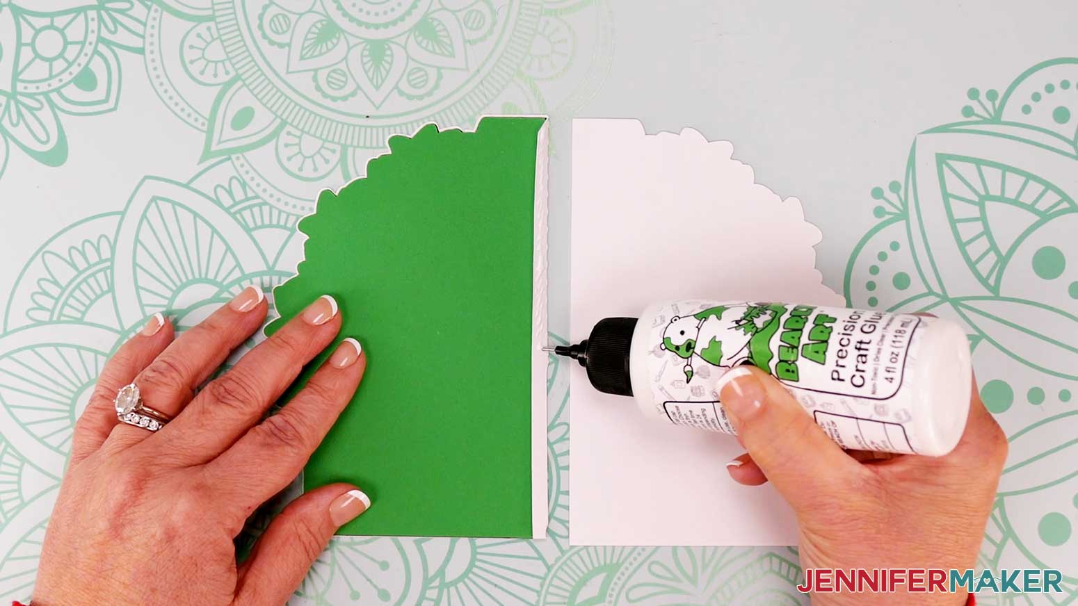 Add glue to the tab for the Joy-size tree shaped edge card in order to attach the front and back panels