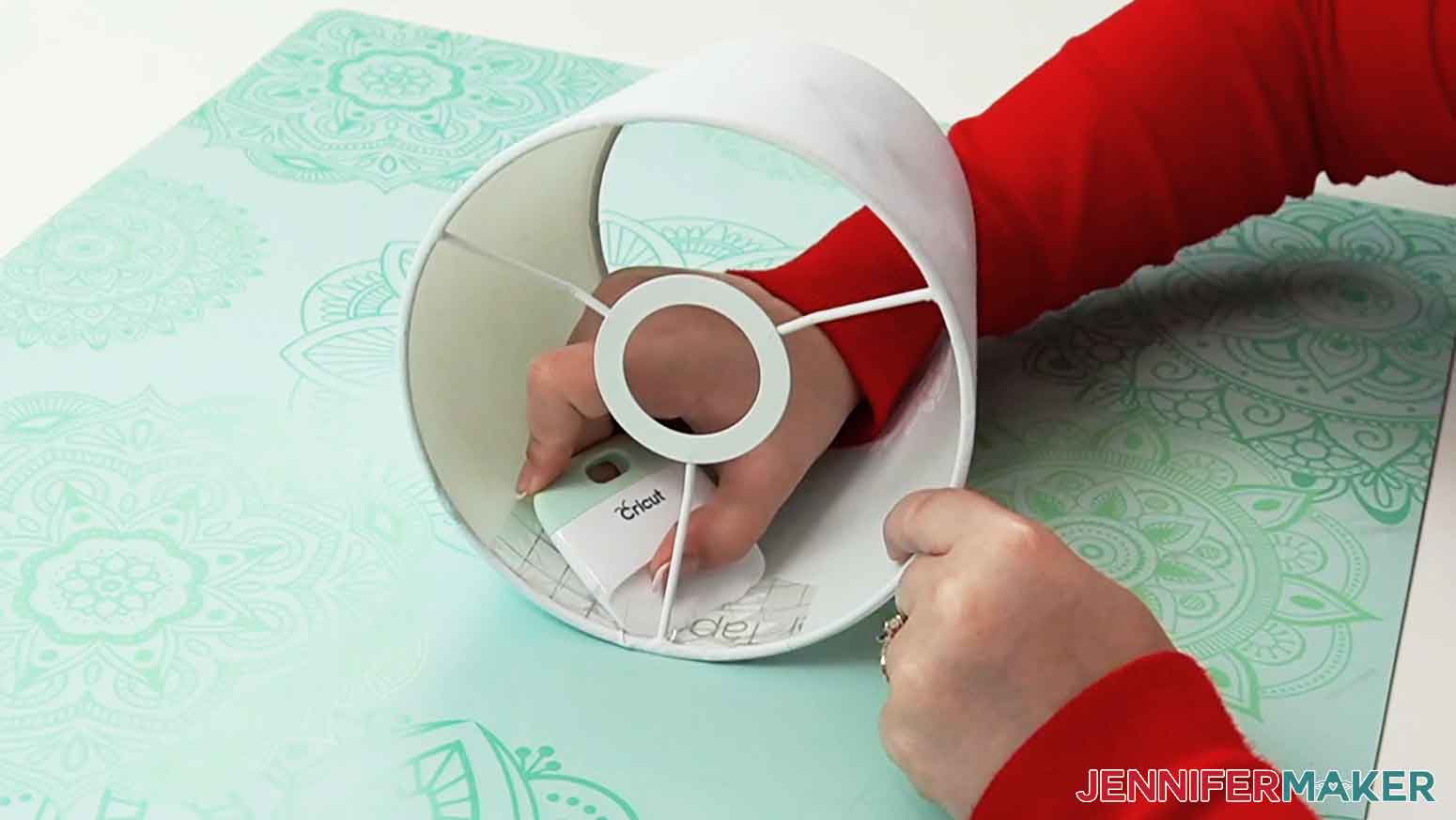 Use a scraper tool to burnish the vinyl to the inside of the lampshade.