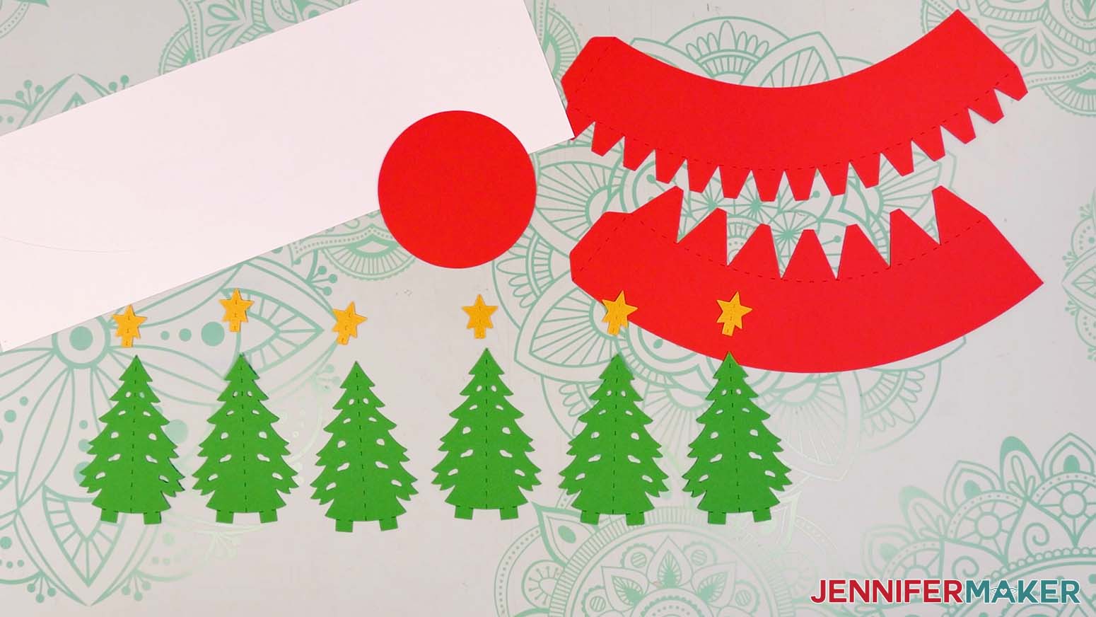 The cut cardstock and vinyl pieces for the snow globe gift box tree design.