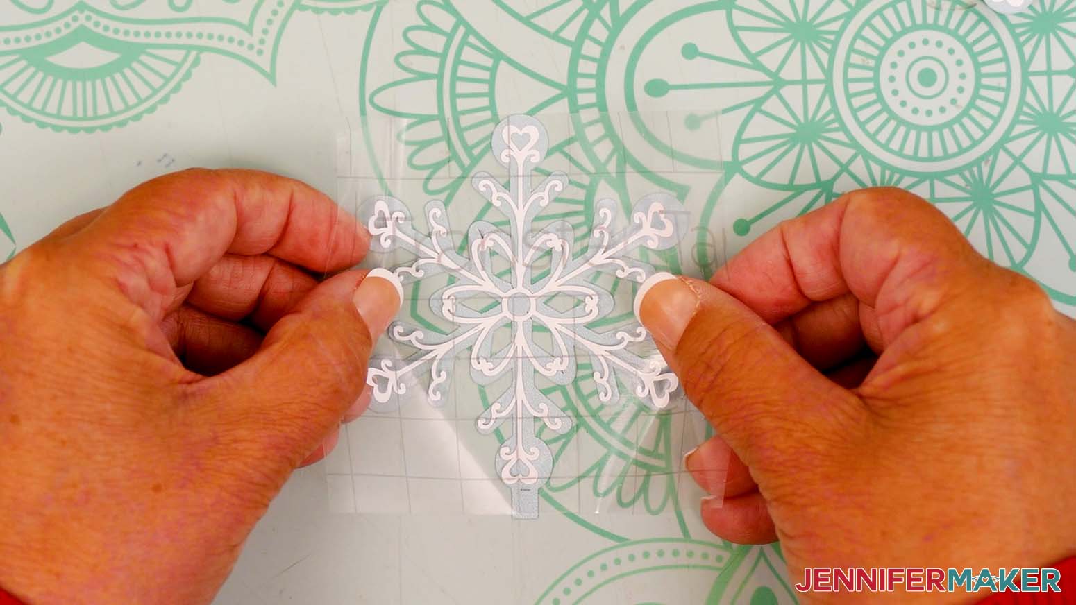 Apply a vinyl decal in the center of the cardstock snowflake piece.