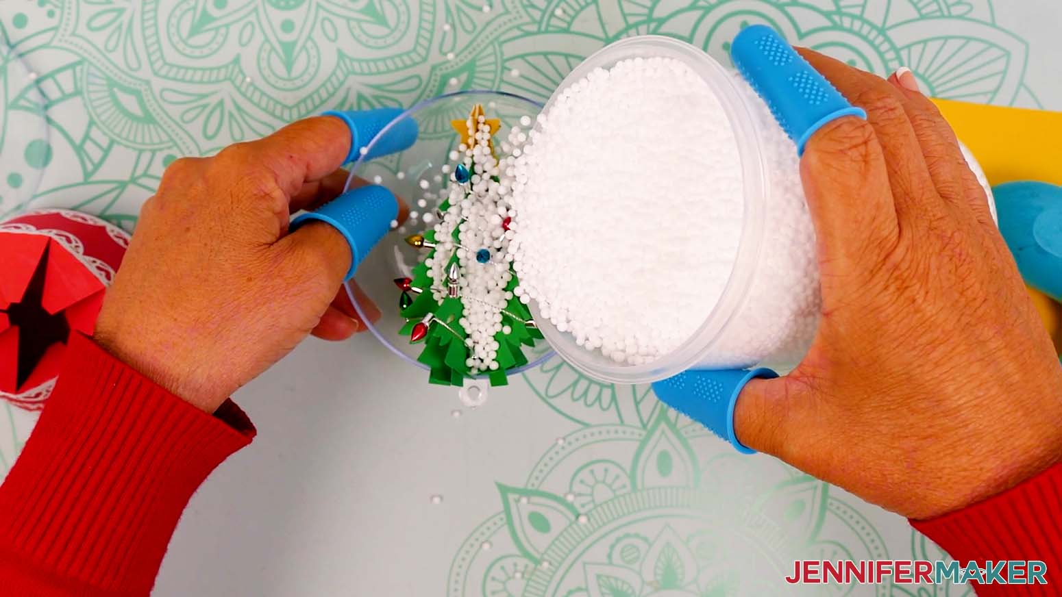 Fill about 30% to 50% of the globe’s bottom half with fake snow.
