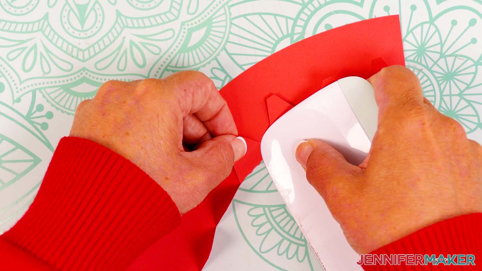Fold down the top tabs of the lid piece, away from the vinyl side.